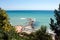Panoramic view from the top to the sea horizon, beach of Balchik Bulgaria, blue sky, sea waves and track in the water, green