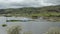 Panoramic view of tourist boats anchored in the Colta Lagoon on a cloudy day - Ecuador