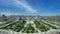 Panoramic view of tourists gathering around Royal Palace (Palacio Real), Plaza de Oriente, Lepanto Gardens (Jardines de Lepanto) a