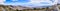 Panoramic view towards Badwater Basin from the trail to Telescope Peak, Death Valley National Park, hiker following a trail on the