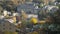 Panoramic view of the town of hebden bridge in west yorkshire with streets of stone houses on steep hills in autumn sunlight