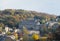 Panoramic view of the town of hebden bridge in west yorkshire with streets of stone houses on steep hills in autumn sunlight
