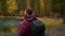 Panoramic View of Traveling Backpacker Hiker Male Enjoy Picturesque Lake Viewing