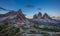 Panoramic view of Tre Cime and rifugio hut before sunrise in summer, Tre Cime di Lavaredo National Park, Dolomites, Italy