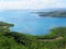 Panoramic view of tropical landscape with lush vegetation, Caribbean sea and summer sky with cumulus clouds in the French West