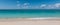 Panoramic view of tropical white sand beach and sea of â€‹â€‹the Cayman Islands.