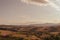 Panoramic view of the Tuscan countryside with the characteristic colors of its hills