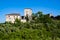 Panoramic view of the Tuscan hills with medieval houses surrounded by blooming nature