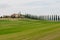 Panoramic view of tuscan landscape with green fields and rows of cypress trees, Tuscany, Italy