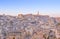 Panoramic view of typical stones and church of Matera and the Madonna de Idris under begin sunset sky