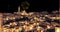 Panoramic view of typical stones Sassi di Matera and church of Matera at night, with golden abstract blinking sparkle