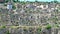 Panoramic view of typical stones Sassi di Matera and church of Matera under blue sky. Basilicata, Italy, zoom out camera