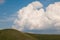 Panoramic view of umbria mountain with cumulonimbus cloud in the background during spring season, Italy