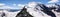 Panoramic view of the Val Poschiavo and Piz Palu in the Bernina mountains as seen from the summit of Piz Cambrena