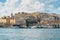 Panoramic view of Valletta,Malta.City skyline from Birgu Vittoriosa harbor.Peaceful cityscape,sunny summer day.Waterfront houses