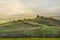 Panoramic view of valley Val D`Orcia on sunrise. Tuscany, Italy