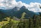 Panoramic view of Vigo di Fassa touristic mountain city on summer day of sun, Trentino, Italy