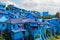 Panoramic view of village with houses painted in blue color