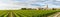 Panoramic view of vineyards of Saint Emilion, Bordeaux, Gironde, France. Medieval church in old town and rows of vine on