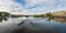 Panoramic view of Vltava River with Stitkovsky weir small dam and Sitkov Water Tower - Prague, Czech Republic