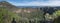 Panoramic view of volcanic landscape of Caldera de Bandama crater and Pico de Bandama with circular hiking trail. Gran