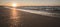 Panoramic view of a warm summer sunset on the Black Sea coast with stormy violent waves