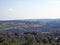 Panoramic view west yorkshire countryside with the village of warley surrounded by woodland and farmland with pennine hills in