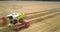 Panoramic view wheat loading process into lorry on farmland