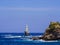 Panoramic view of the white lighthouse of Andros island, in the