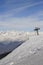 Panoramic view of wide and groomed ski piste in resort of Pila in Valle d`Aosta, Italy during winter