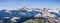 Panoramic view of wilderness areas in Yosemite National Park with mountain peaks covered in snow; Sierra Nevada mountains,