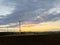 Panoramic view of wind farm or wind park on sundown, with high wind turbines for generation electricity with copy space