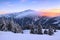 A panoramic view. Winter. Amazing sunrise. Landscape of high mountains with snow white peaks and forests. Aerial view. Wallpaper