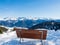 Panoramic view with wood bench in winter in resort Ladis, Fiss, Serfaus in ski resort in Tyrol