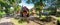 Panoramic view of wooden playground with magic houses and slide in Duthie park, Aberdeen