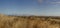 panoramic views of dry grassy drought stricken farm