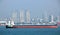 Panoramic views of the port and the city of Singapore during day and night. Kind of cargo and merchant vessels anchored.