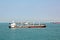 Panoramic views of the port and the city of Singapore during day and night. Kind of cargo and merchant vessels anchored.