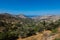 Panoramic wide angle view over a  in the cyclades archipelago, Naxos, Greece. Blue Aegean Sea on the horizon, dry brown landscape