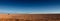 Panoramic wide banner landscape view near â€œOjos del Salarâ€ in Atacama Desert, Chile. Tire tracks contrasting the wilderness