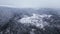Panoramic winter drone view of the mountains in the forest. Cinematic winter snowy forest.
