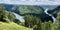 Panoramic wonderful view of a mountain lake in front of a mountain range, national park of the Republic of Bashkortostan