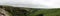 Panorma of Malham Cove landscape in Yorkshire Dales National Park in England on a cloudy day