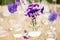 Pansy flowers in chemical glassware, table decoration in garden