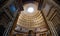 Pantheon entrance and roof of a large historic building with a large hole in the roof