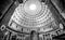 Pantheon entrance and roof of a large historic building with a large hole in the roof