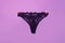 Panties. Female lace lingerie. Womans erotic black underwear panties. Women's panties hanging on rope isolated on