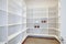 Pantry interior with empty shelves in a new home