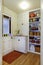 Pantry view with storage shelves in Small hallway.