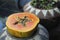 Papaya cut in half with seeds in a flower pot